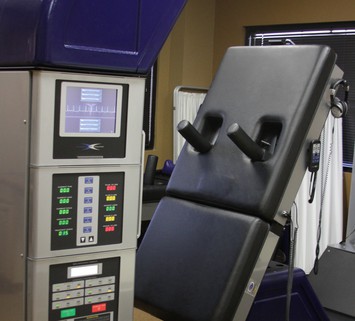 Side view of DRX 9000 Back Therapy Machine at Texas Spine Center in Houston